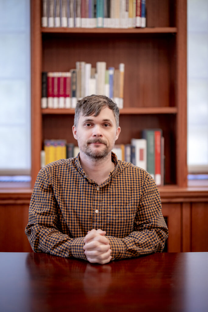 A man seated at a table.